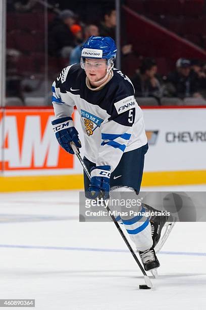 Aleksi Makela of Team Finland skates with the puck during the warmup period prior to the 2015 IIHF World Junior Hockey Championship game against Team...