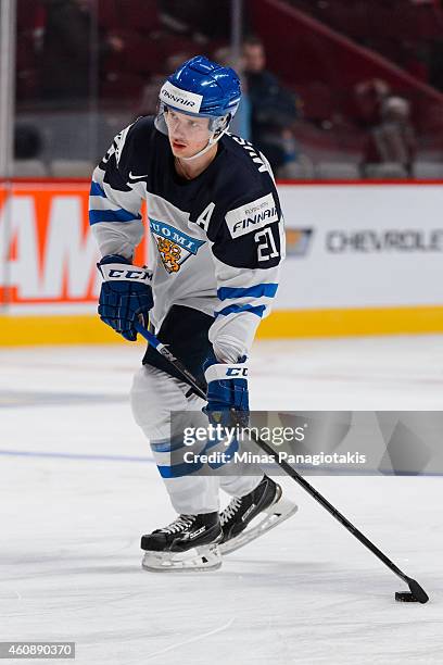 Aleksi Mustonen of Team Finland skates with the puck during the warmup period prior to the 2015 IIHF World Junior Hockey Championship game against...