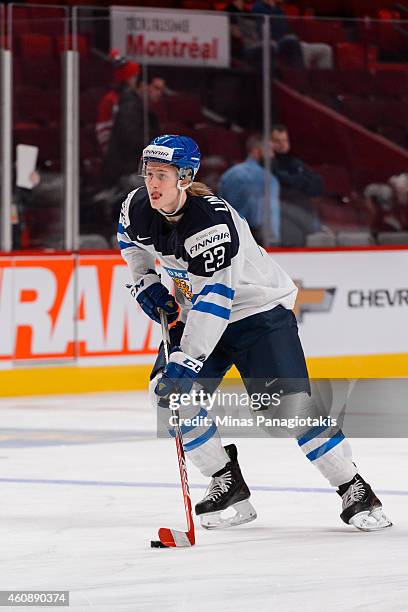 Alex Lintuniemi of Team Finland carries the puck during the warmup period prior to the 2015 IIHF World Junior Hockey Championship game against Team...