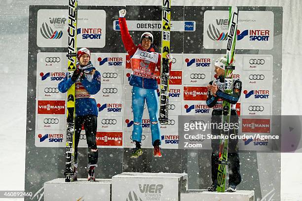 Michael Hayboeck of Austria takes 2nd palce, Stefan Kraft of Austria takes 1st place,Peter Prevc of Slovenia takes 3rd during the FIS Ski Jumping...