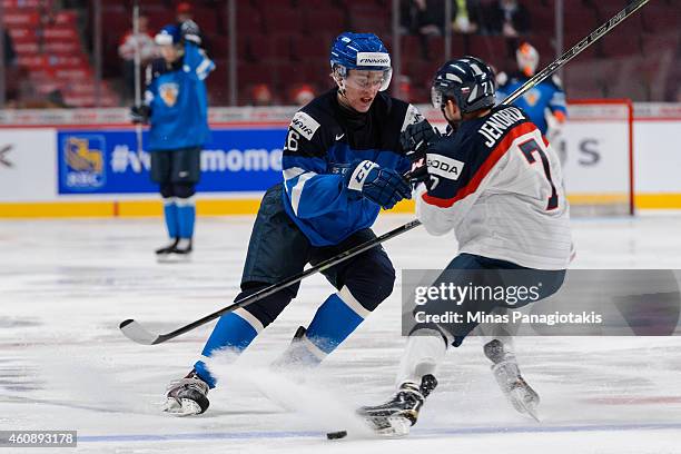 Dominik Jendrol of Team Slovakia blocks Mikko Rantanen of Team Finland during the 2015 IIHF World Junior Hockey Championship game at the Bell Centre...