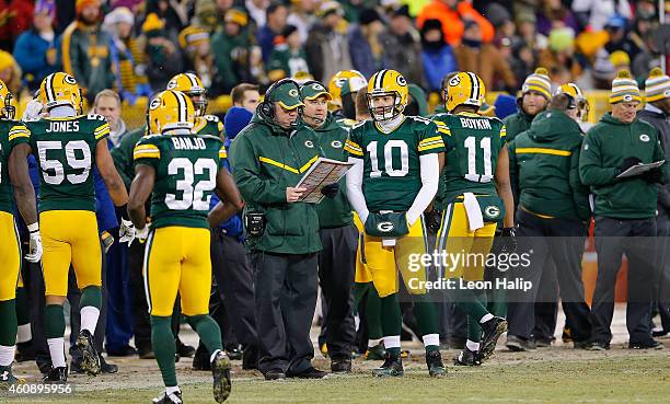 Green Bay Packers head coach Mike McCarthy talks with backup quarterback Matt Flynn at the start of the third quarter of the game against the Detroit...