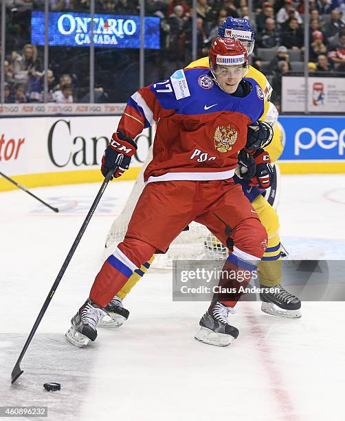 Vyacheslav Leshenko of Team Russia controls the puck against Team Sweden in a 2015 IIHF World Junior Championship game at the Air Canada Centre on...