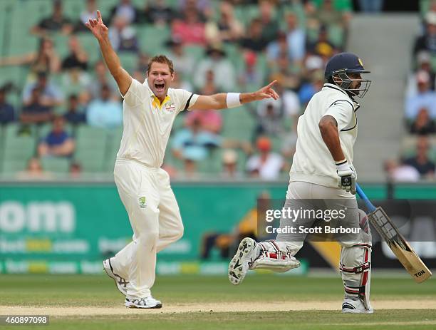 Ryan Harris of Australia appeals successfully to dismiss Shikhar Dhawan of India during day five of the Third Test match between Australia and India...