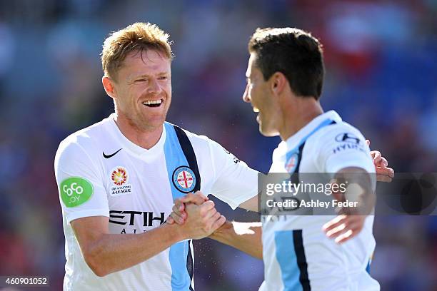 Damien Duff and Robert Koren of Melbourne City celebrate a goal during the round 14 A-League match between the Newcastle Jets and Melbourne City FC...