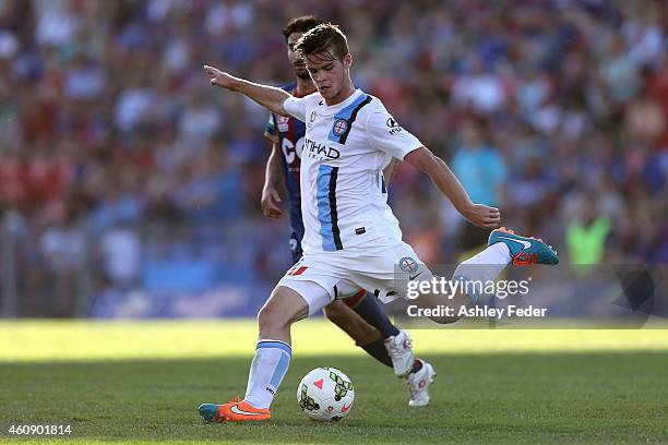 Zenon Caravella of the Jets contests the ball against Connor Chapman of Melbourne City during the round 14 A-League match between the Newcastle Jets...