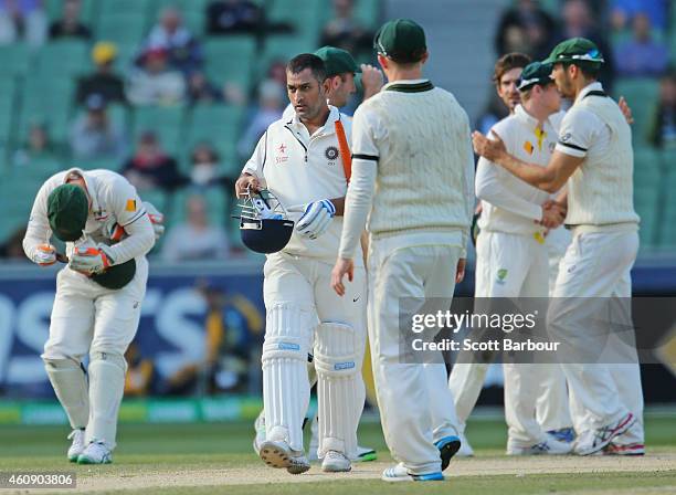 Dhoni of India leaves the field as the game is called off for a draw during day five of the Third Test match between Australia and India at Melbourne...