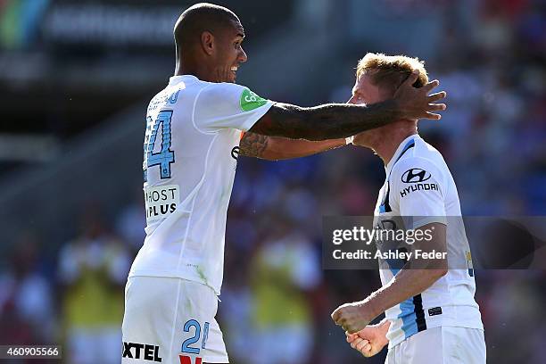 Patrick Kisnorbo and Damien Duff of Melbourne City FC celebrate Melbournes third goal during the round 14 A-League match between the Newcastle Jets...