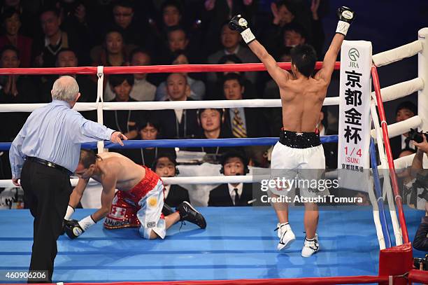 Naoya Inoue of Japan celebrates as Omar Andres Narvaez of Argentina downs in the first-round during the WBO World Super Flyweight Title bout between...