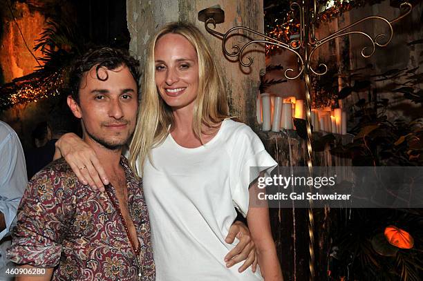 Fashion designer Esteban Cortazar and Lauren Santo Domingo pose for a photo during the Pre New Year´s Affair in celebration of the Opening of W...