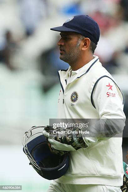 Dhoni of India leaves the field on day five of the Third Test match between Australia and India at Melbourne Cricket Ground on December 30, 2014 in...