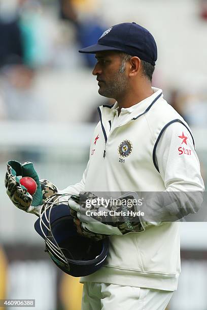 Dhoni of India leaves the field on day five of the Third Test match between Australia and India at Melbourne Cricket Ground on December 30, 2014 in...