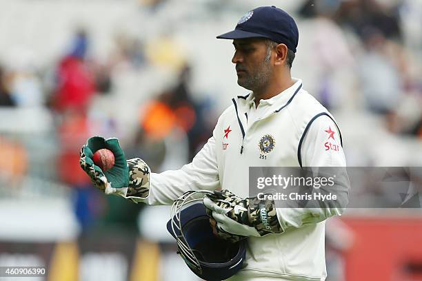 Dhoni of India leaves the field on day five of the Third Test match between Australia and India at Melbourne Cricket Ground on December 30, 2014 in...