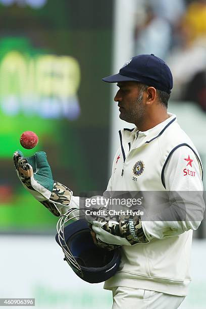 Dhoni of India leaves the field on day five of the Third Test match between Australia and India at Melbourne Cricket Ground on December 30, 2014 in...