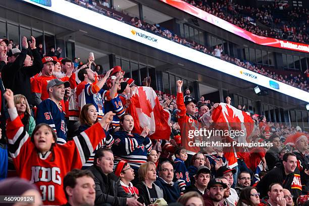 Fans cheer on Team Canada during the 2015 IIHF World Junior Hockey Championship game against Team Germany at the Bell Centre on December 27, 2014 in...