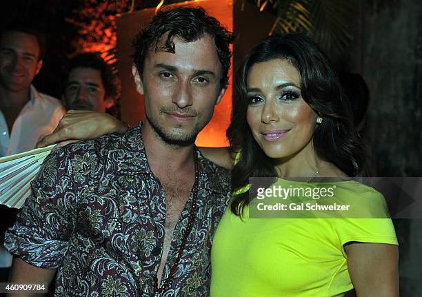 Fashion designer Esteban Cortazar and actress Eva Longoria pose for a photo during the Pre New Year´s Affair in celebration of the Opening of W...