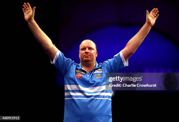 Vincent van der Voort of Holland celebrates winning his third round match against Dean Winstanley of England during the William Hill PDC World Darts...