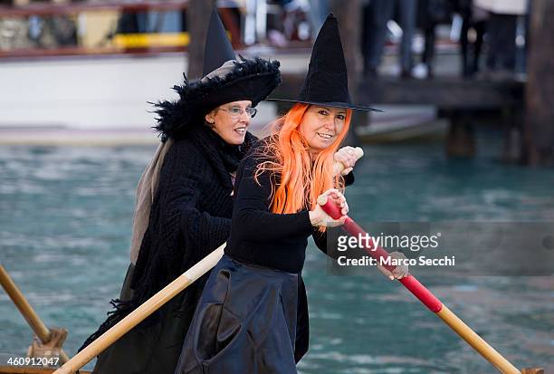 Participants dressed in costume row on the Grand Canal ahead of the "Befana" Regatta on January 6, 2014 in Venice, Italy. In Italian folklore, Befana...