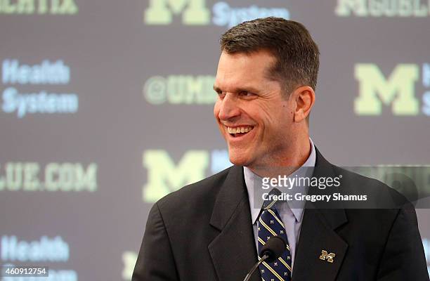Jim Harbaugh speaks as he is introduced as the new Head Coach of the University of Michigan football team at the Junge Family Champions Center on...