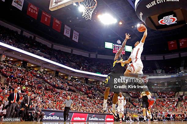 DÕAngelo Russell of the Ohio State Buckeyes attempts to shoot the ball against the defense of Anthony Clemmons of the Iowa Hawkeyes during the second...