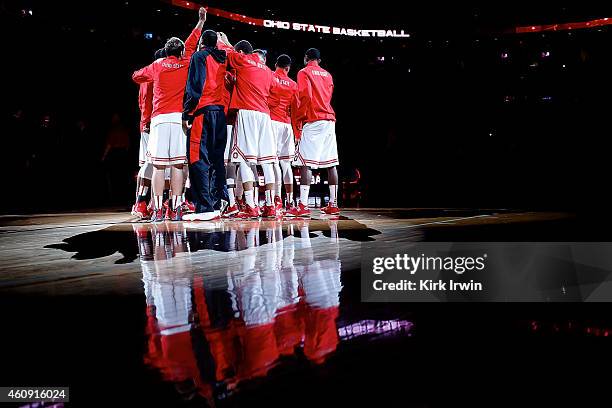 Members of the Ohio State Buckeyes huddle up prior to the start of the game against the Iowa Hawkeyes at Value City Arena on December 30, 2014 in...