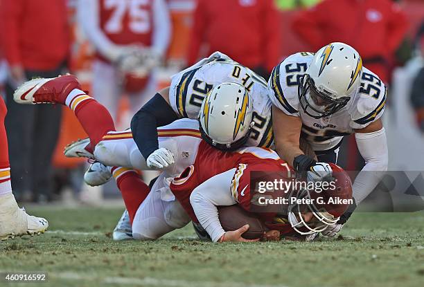 Defenders Manti Te'o and Andrew Gachkar tackle quarterback Chase Daniel of the San Diego Chargers of the Kansas City Chiefs during the second half on...