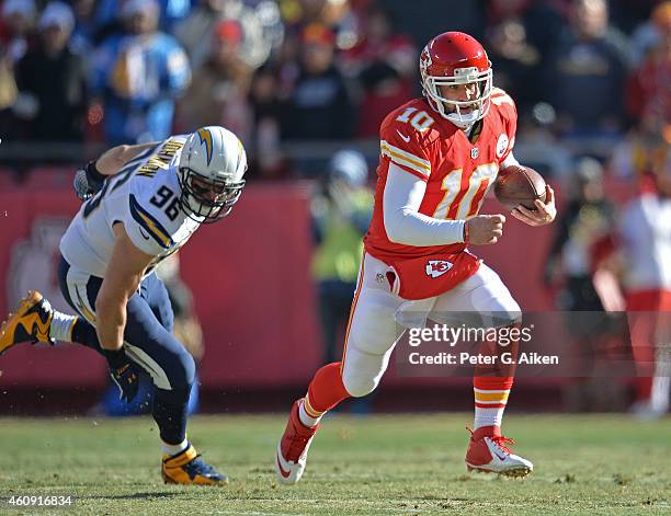 Quarterback Chase Daniel of the Kansas City Chiefs runs up field past linebacker Jarret Johnson of the San Diego Chargers during the first half on...