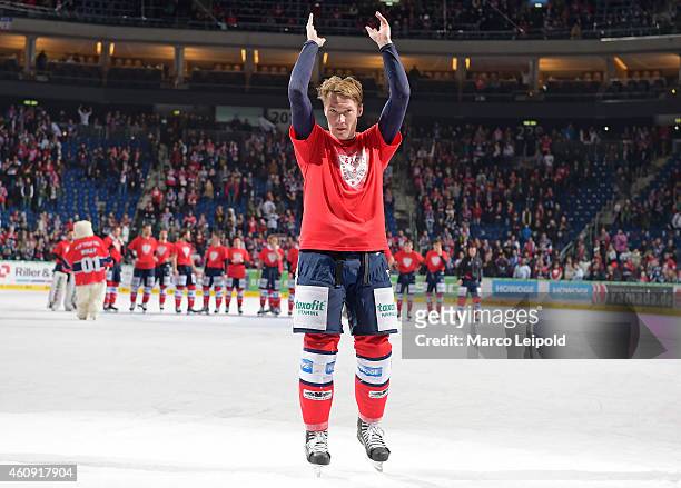 Antti Miettinen of the Eisbaeren Berlin celebrates the win with the fans during the game between Eisbaeren Berlin and ERC Ingolstadt on December 30,...