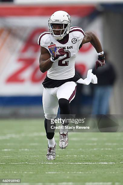 Speedy Noil of the Texas A&M Aggies runs a pass route against the West Virginia Mountaineers during the 56th annual Autozone Liberty Bowl at Liberty...
