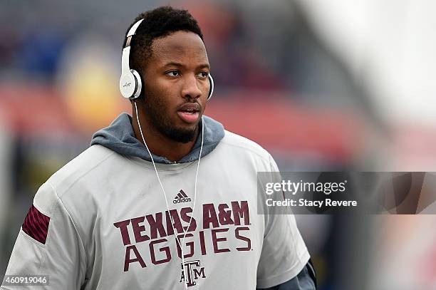 Cedric Ogbuehi of the Texas A&M Aggies participates in warmups prior to the 56th annual Autozone Liberty Bowl against the West Virginia Mountaineers...