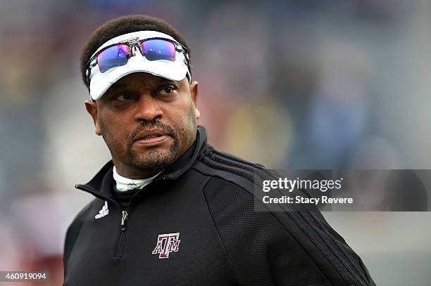 Head coach Kevin Sumlin of the Texas A&M Aggies watches his team prior to a game against the West Virginia Mountaineers in the 56th annual Autozone...