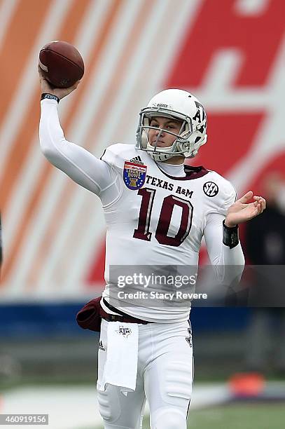 Kyle Allen of the Texas A&M Aggies participates in warmups prior to the 56th annual Autozone Liberty Bowl against the West Virginia Mountaineers at...