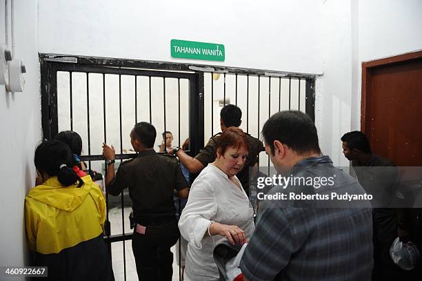 Andrea Waldeck's mother and brother visit her in a women's prison cell before hearing court for drug trafficking charges on January 6, 2014 in...