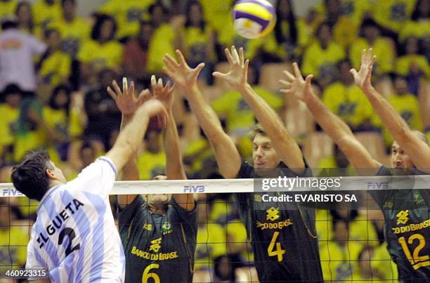 Players of the Brazilian National Volleyball Team, Nalbert , Andre , and Mauricio , try to block the ball from the Argentinian Elgueta, Brasilia, 28...