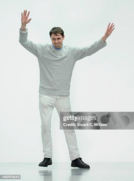 Fashion designer Matthew Miller acknowledges the applause of the audience after his show during The London Collections: Men Autumn/Winter 2014 on...