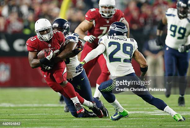 Running back Stepfan Taylor of the Arizona Cardinals runs with the football during the NFL game against the Seattle Seahawks at the University of...