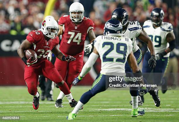 Running back Stepfan Taylor of the Arizona Cardinals runs with the football during the NFL game against the Seattle Seahawks at the University of...