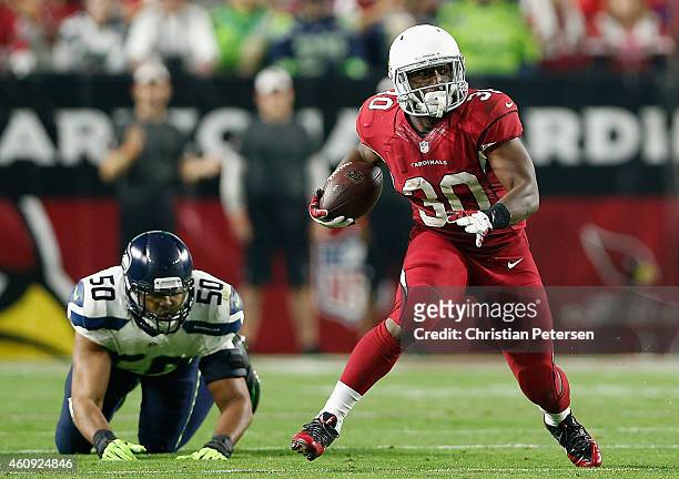 Running back Stepfan Taylor of the Arizona Cardinals runs with the football during the NFL game against the Seattle Seahawks at the University of...