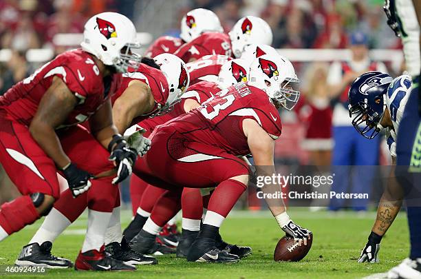 Center Lyle Sendlein of the Arizona Cardinals prepares to snap the football during the NFL game against the Seattle Seahawks at the University of...