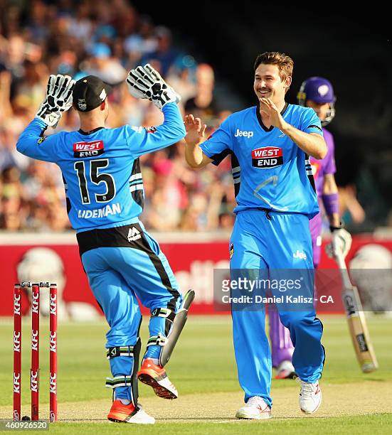Kane Richardson of the Adelaide Strikers celebrates with Tim Ludeman of the Adelaide Strikers after taking the wicket of Ben Dunk of the Hobart...