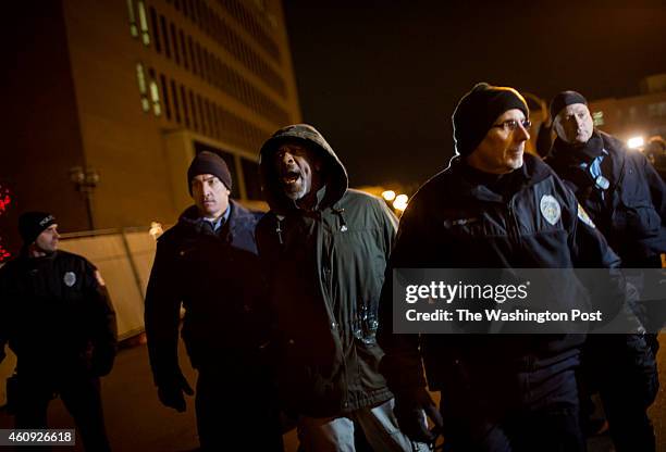 Man is arrested outside the Buzz Westfall Justice Center where St. Louis County grand jury is considering whether or not to charge Officer Darren...