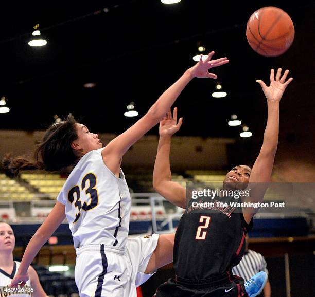 Stonewall Jackson's Genesis Parker gets a shot over the fingertips of Georgetown Visitation's Maddy Reed in the Title IX Holiday Invitational Classic...