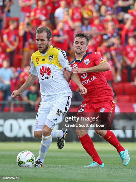 Jeremy Brockie of the Phoenix and Cameron Watson of United compete for the ball during the round 14 A-League match between Adelaide United and...