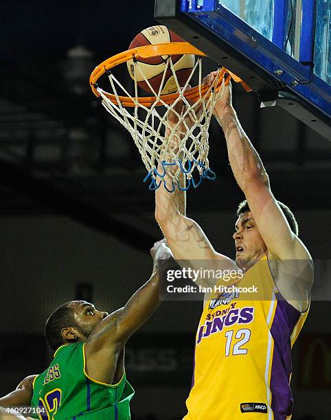 Angus Brandt of the Kings scores past Mickell Gladness of the Crocs during the round 13 NBL match between the Townsville Crocodiles and Sydney Kings...