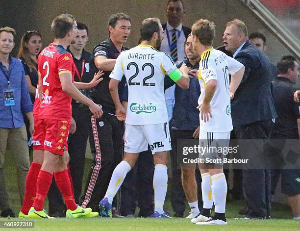 Josep Gombau , coach of Adelaide United leaves his area to argue with Andrew Durante of the Phoenix during the round 14 A-League match between...