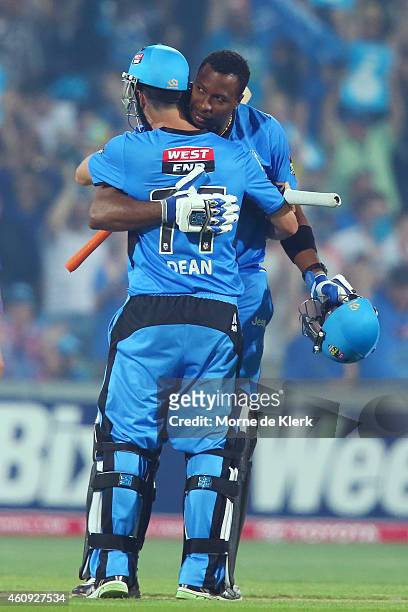 Kieron Pollard of the Adelaide Strikers conratulates teammate Jono Dean after the Strikers won the Big Bash League match between the Adelaide...