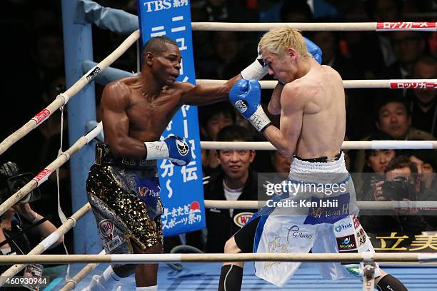 Guillermo Rigondeaux of Cuba and Hisashi Amagasa of Japan exchange punches during the WBA/WBO world super bantamweight bout between Guillermo...