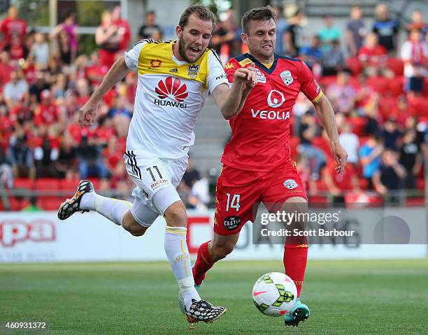 Jeremy Brockie of the Phoenix and Cameron Watson of United compete for the ball during the round 14 A-League match between Adelaide United and...