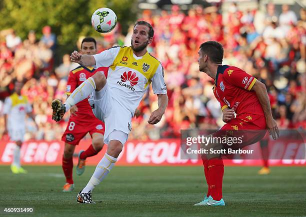 Jeremy Brockie of the Phoenix and Cameron Watson of United compete for the ball during the round 14 A-League match between Adelaide United and...