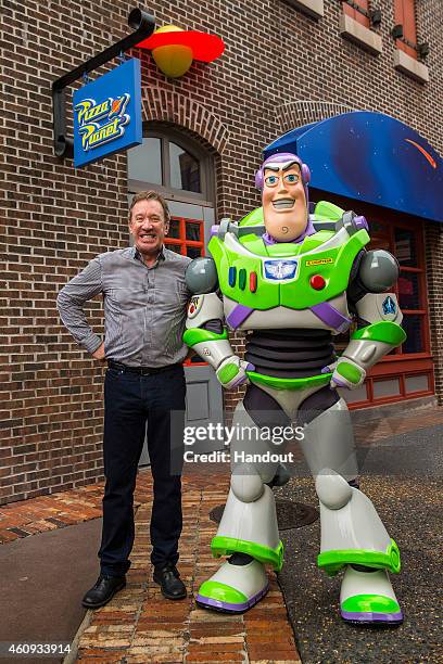 In this handout photo provided by Disney Parks, actor and comedian Tim Allen, the voice of Buzz Lightyear in the Disney-Pixar "Toy Story" series of...